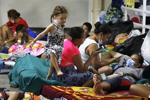 This is a thumbnail for the post At home and away, Hondurans pitch in toward hurricane healing
